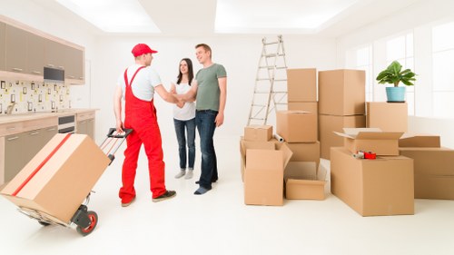 Moving boxes and furniture in a Bloomsbury home